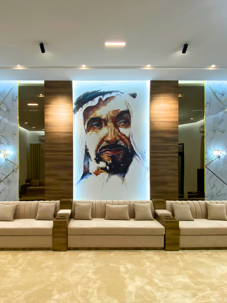 Portrait feature wall of the late Sheikh Zayed in an Arabic majlis by Al Malek Carpentry