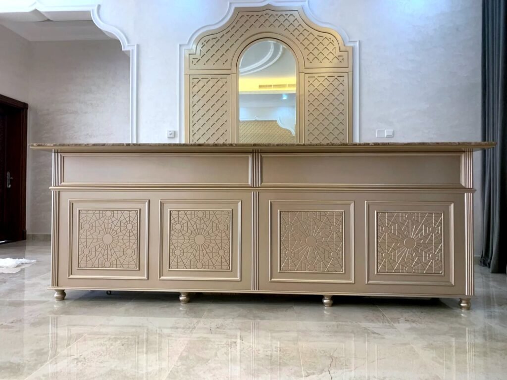 Painted counter with CNC-grooved Islamic geometric door panels and a CNC lattice arch mirror frame, by Al Malek Carpentry