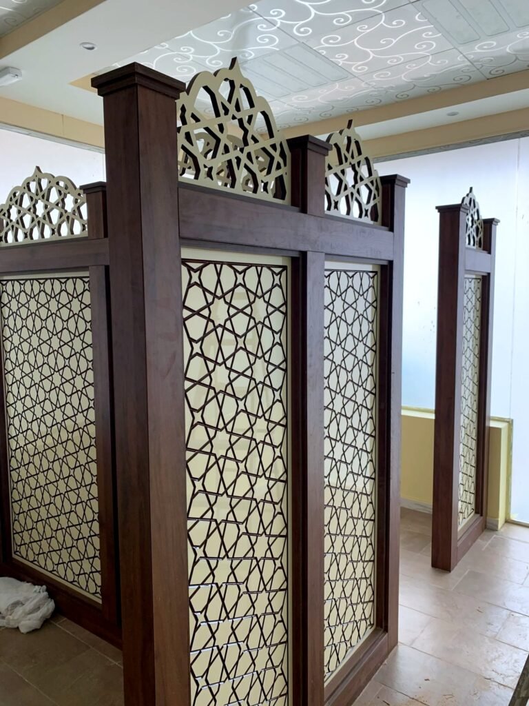 Freestanding partitions with CNC-cut geometric infill panels and arched crest tops, by Al Malek Carpentry