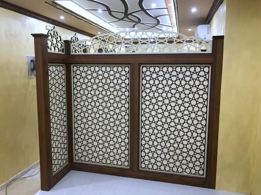 Wooden partition with CNC-cut Islamic geometric panels and a decorative CNC crest, by Al Malek Carpentry