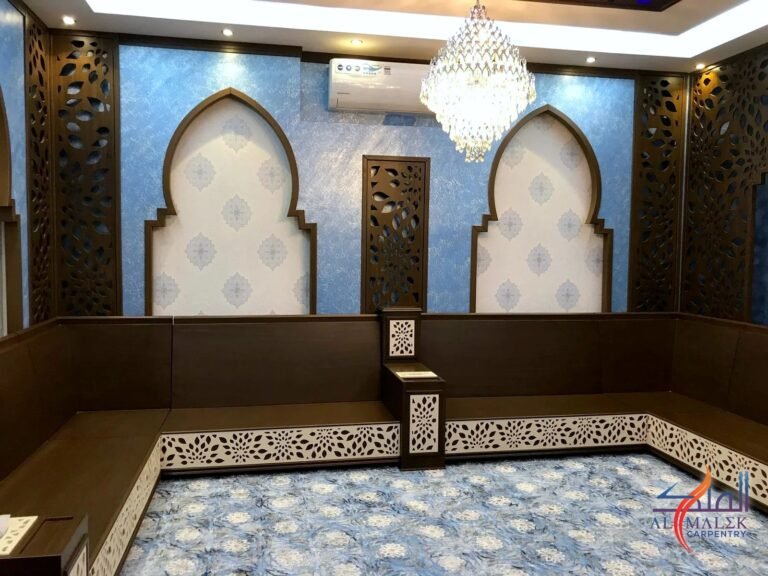 Arabic majlis with arched niches, CNC-cut floral side panels and white CNC-cut seating base panels, by Al Malek Carpentry