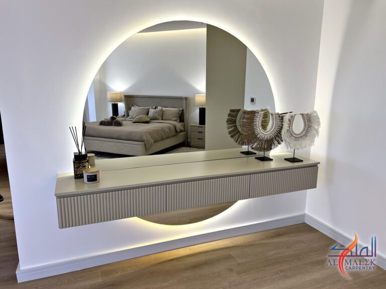 Fluted floating dressing table with backlit round mirror and under-unit LED glow, made by Al Malek Carpentry in Ras Al Khaimah
